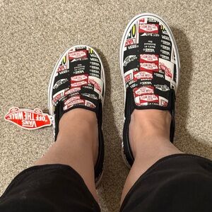 Vans Black Slip-On Sneakers with Red and White Logo Print brand new